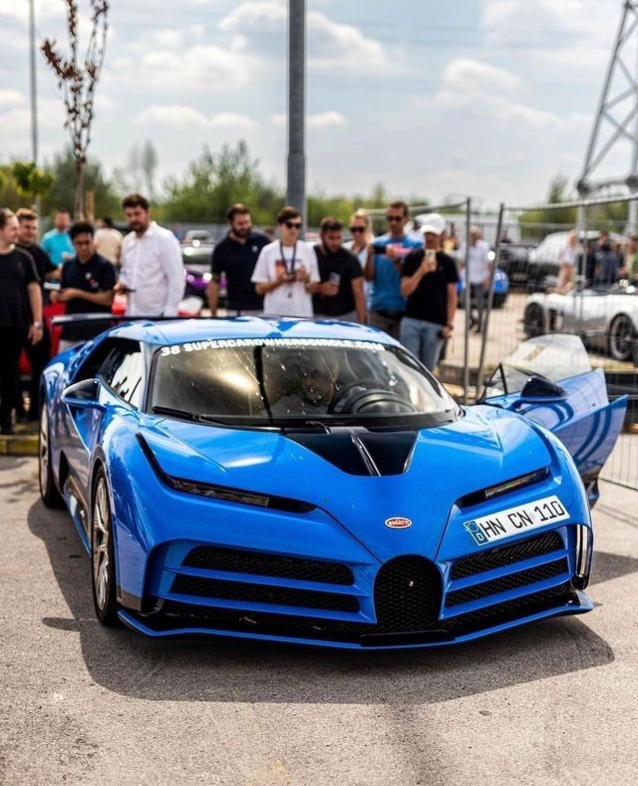 Blue Bugatti Centodieci on the street