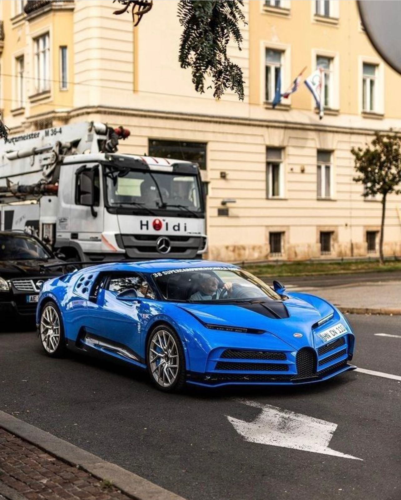 Blue Bugatti Centodieci on the street